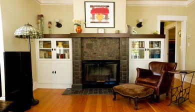 living room fireplace and white bookcases